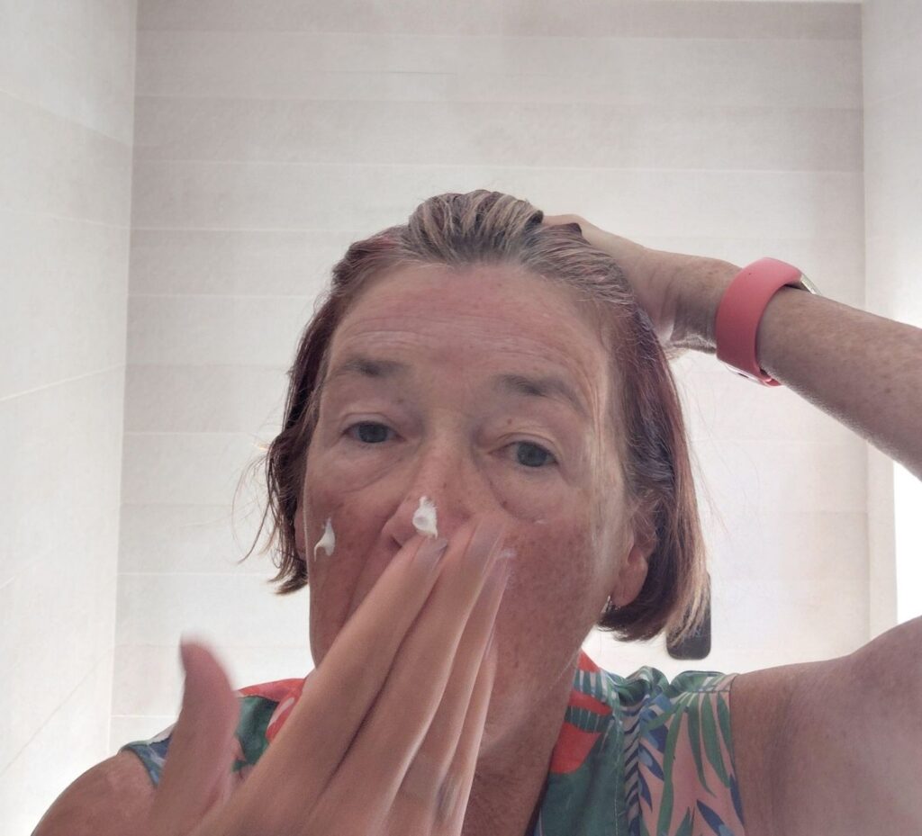 Caro rubbing in her Protecting Day Lotion to demonstrate that prevention is better than cure