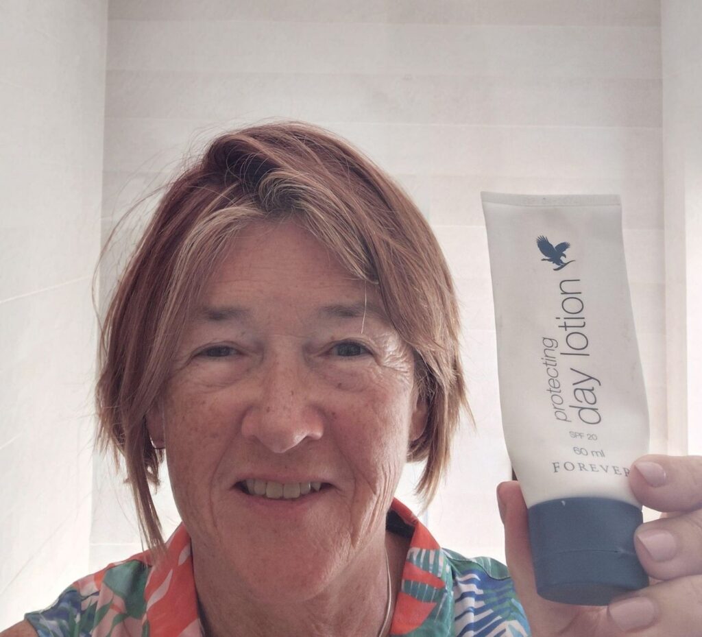 Caro showing her tube of Protecting Day Lotion